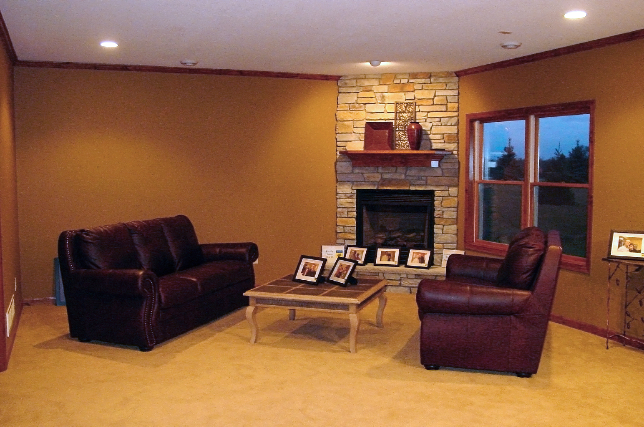 Lower level family room with stone fireplace