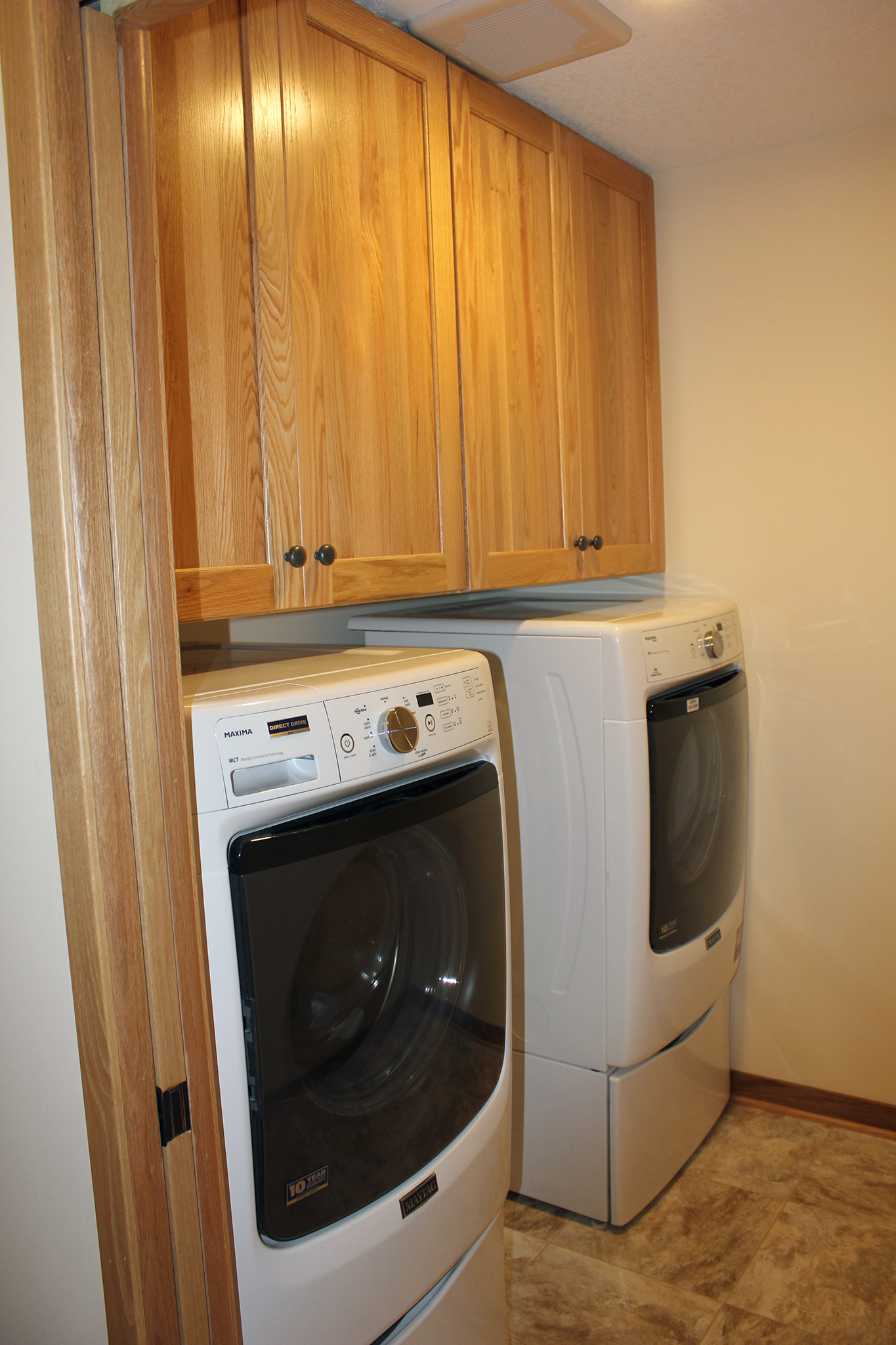 Laundry room with built-in cabinets